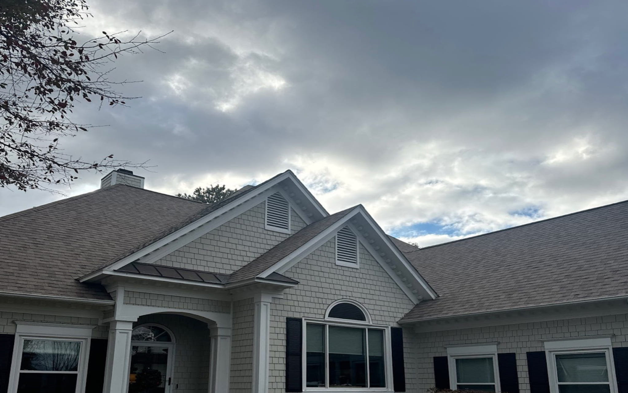 roof with cloudy sky in the back