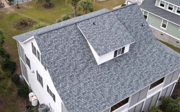 grey shingle roof on a white house
