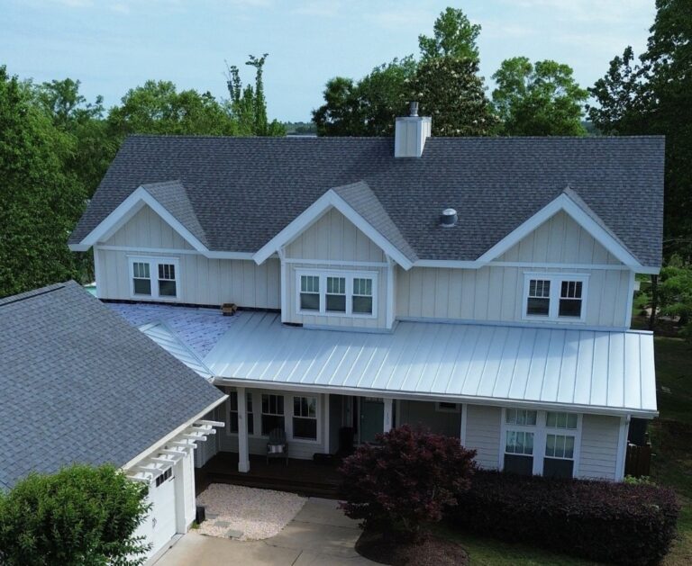 house with both shingle roof and metal roof