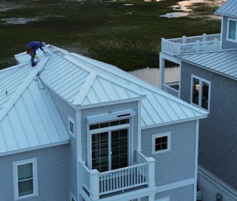 Summit Roofing team working on a metal roof