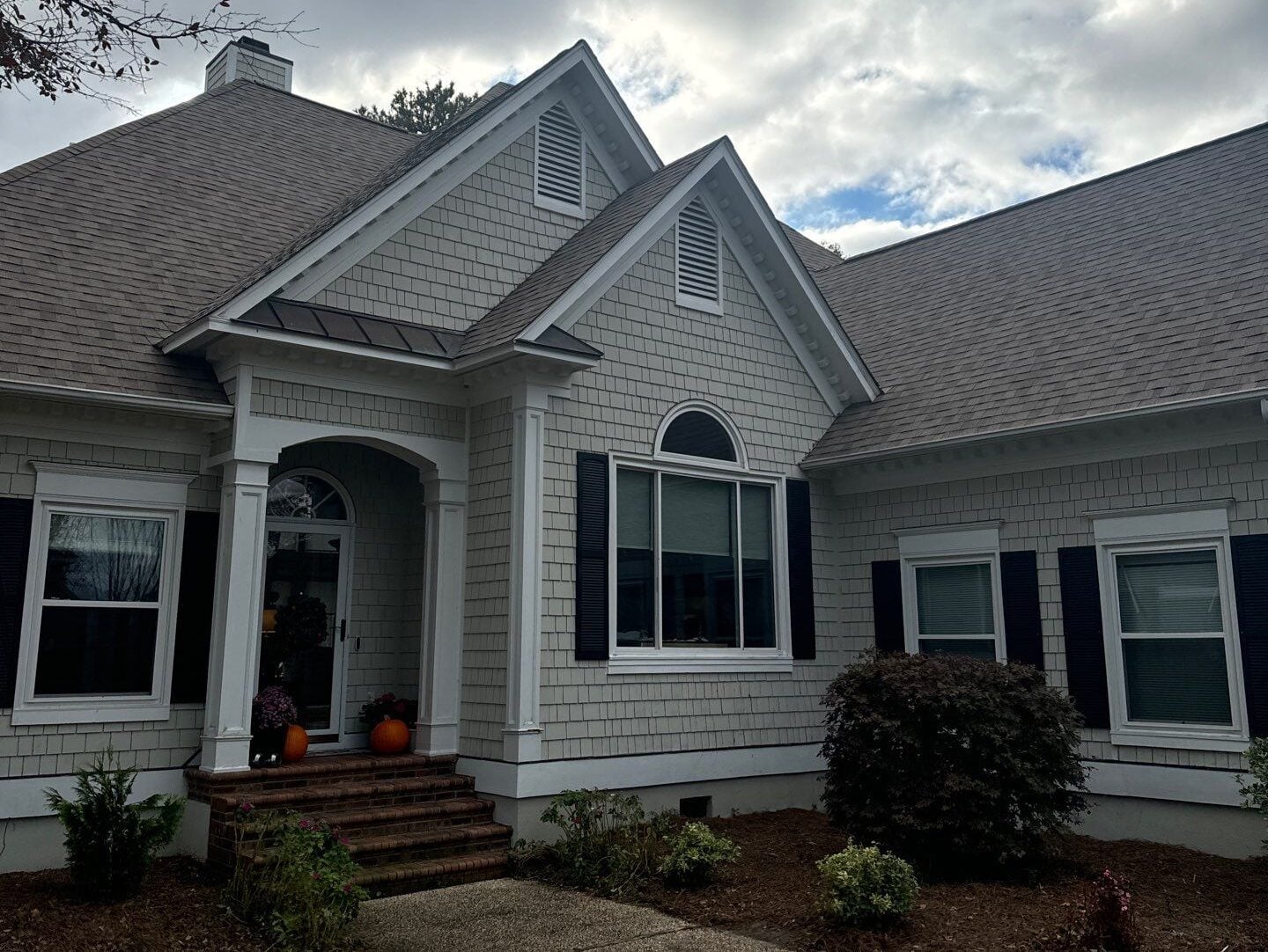 types of roof vents beige siding brown shingles