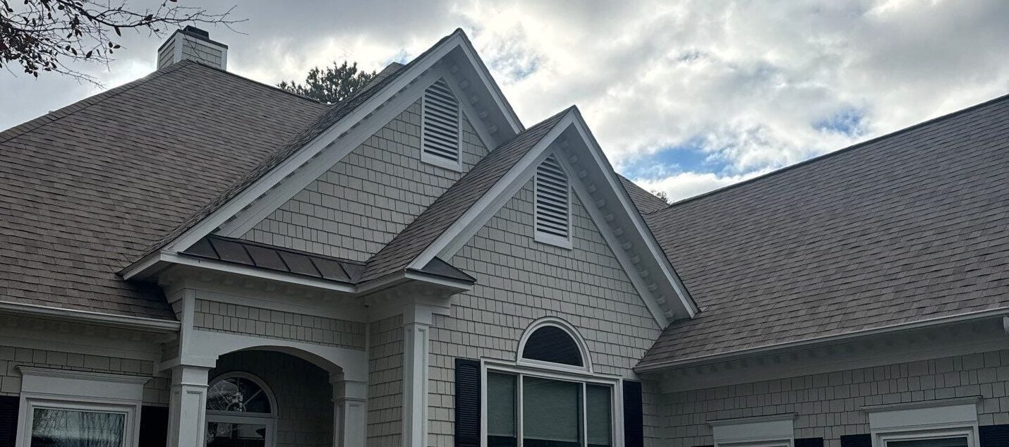 types of roof vents beige siding brown shingles
