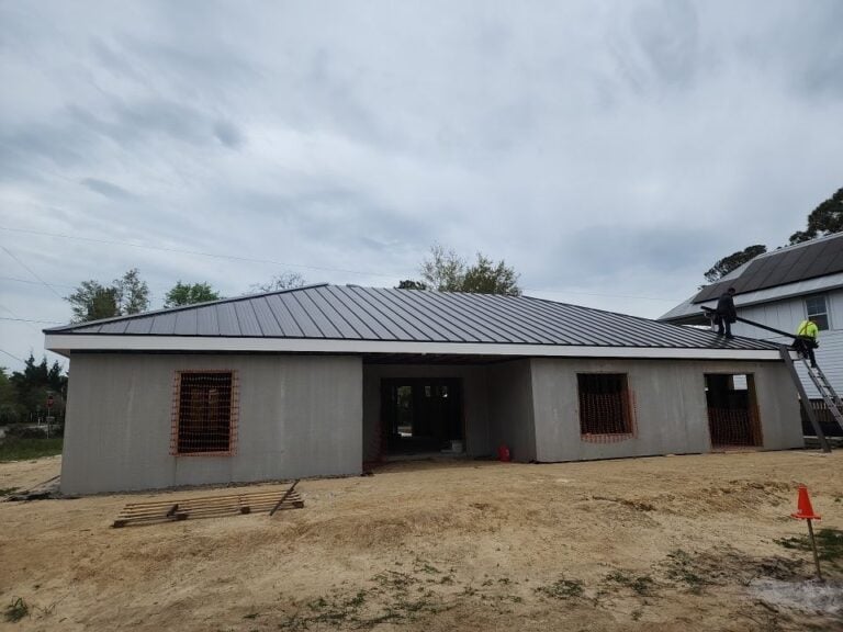 low slope roof grey shingles roof house under construction
