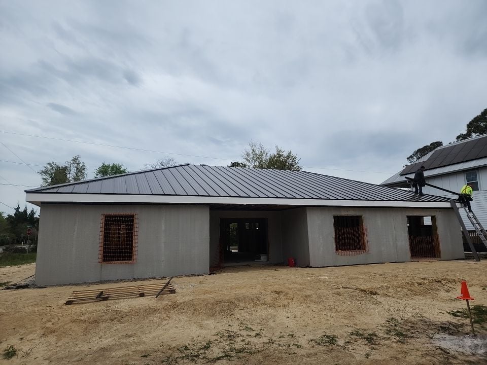 low slope roof grey shingles roof house under construction