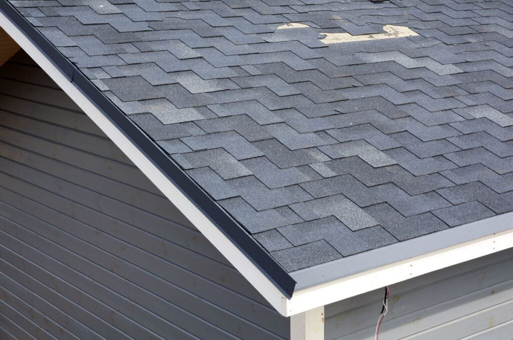 roof repair cost blue shingle missing