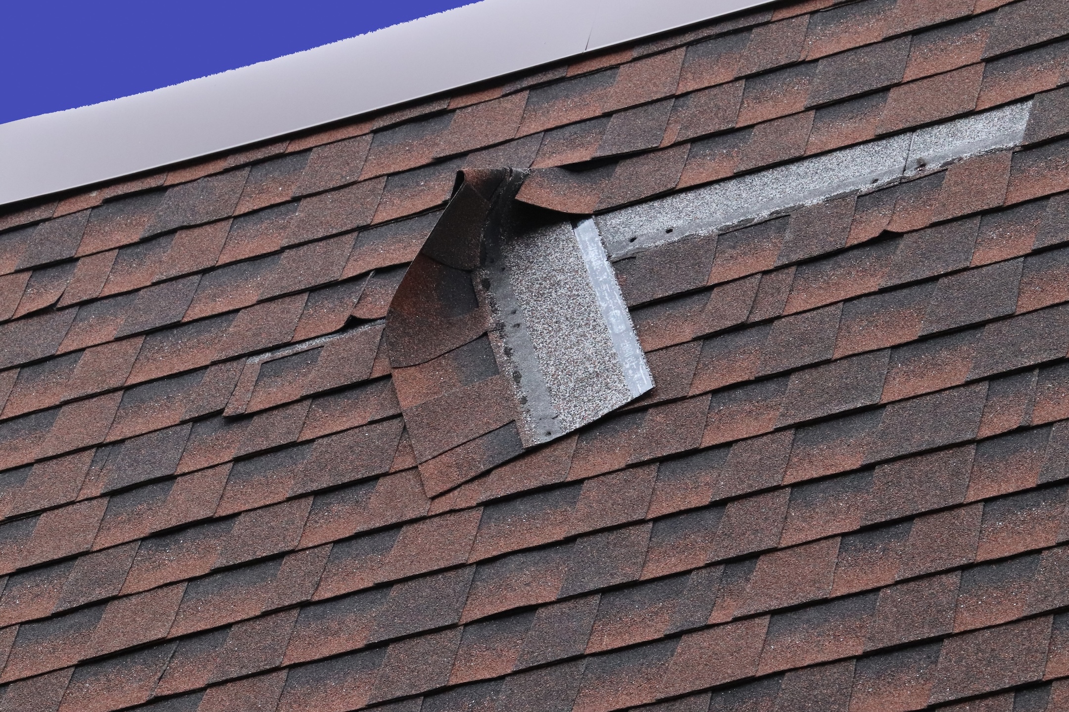 Shingles missing on house roof