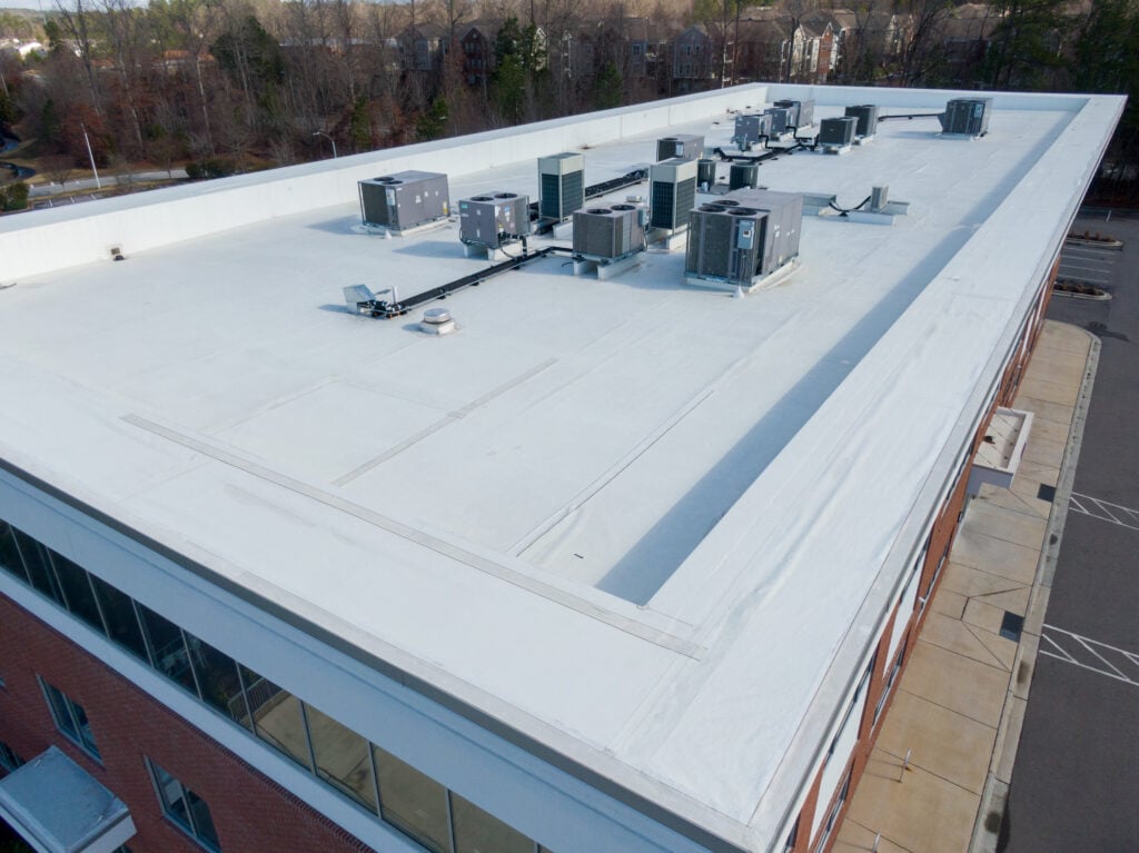 Professional Aerial Drone Image of a TPO Roof Inspection on a Commercial Building: Architecture, Roofing, Engineering, Industry